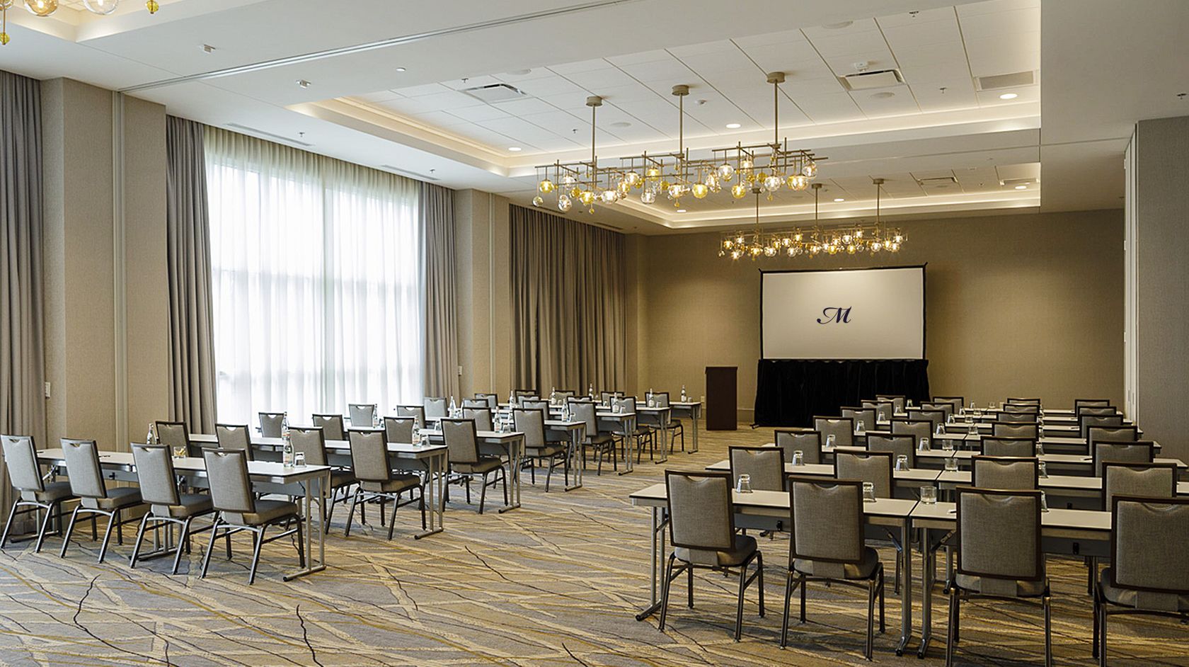 A ballroom at Hotel Madison set up for a presentation